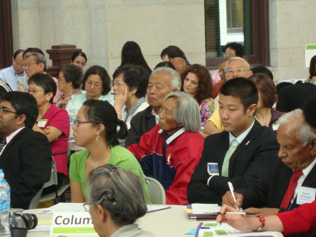 Audience members listen to the message